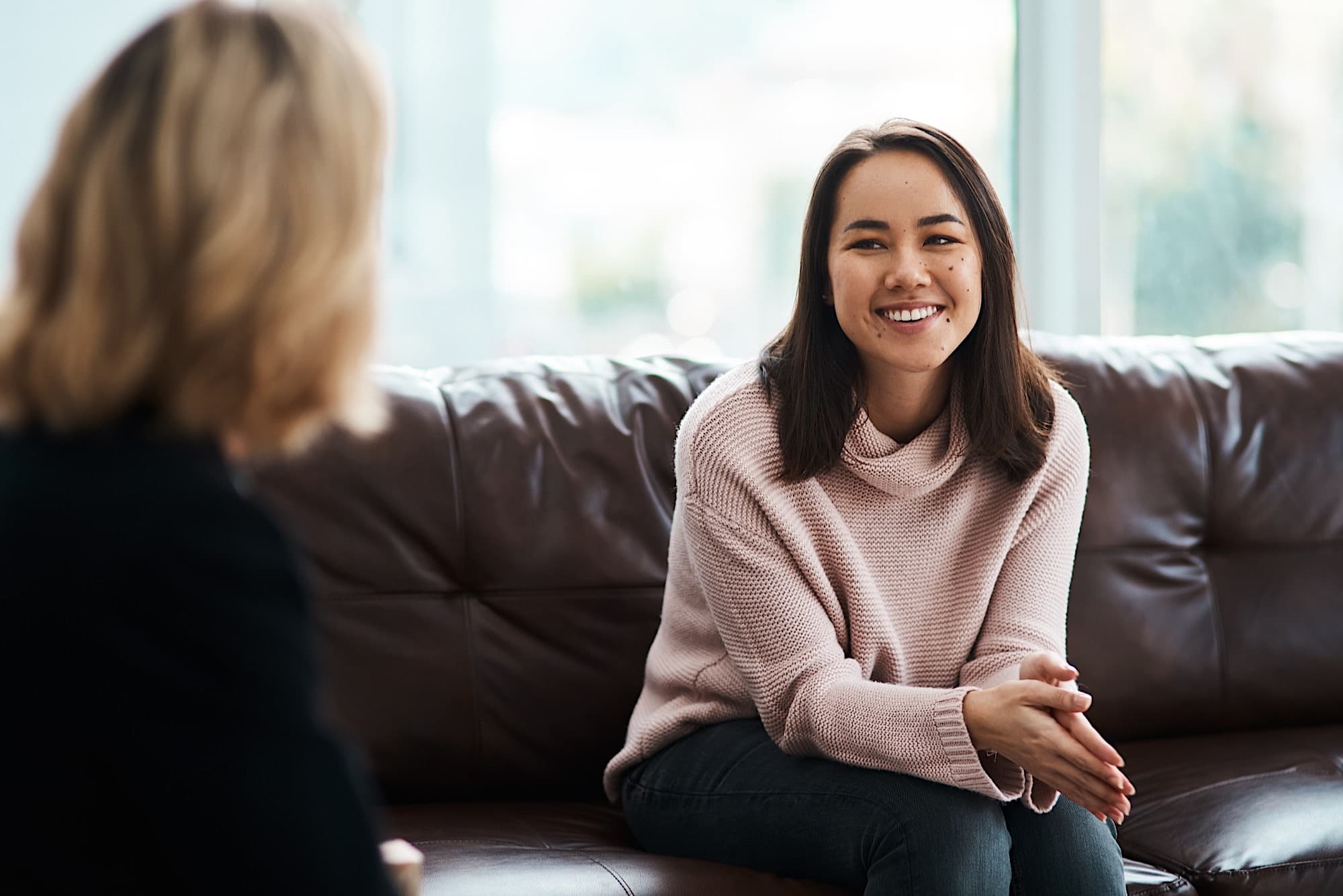 Patient smiling during a psychiatric consultation in Bellevue, WA